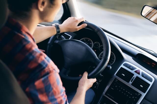 guy driving car