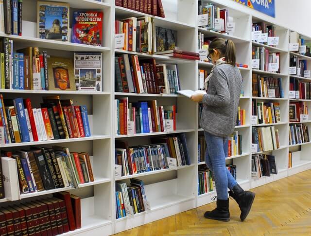 girl looking at books